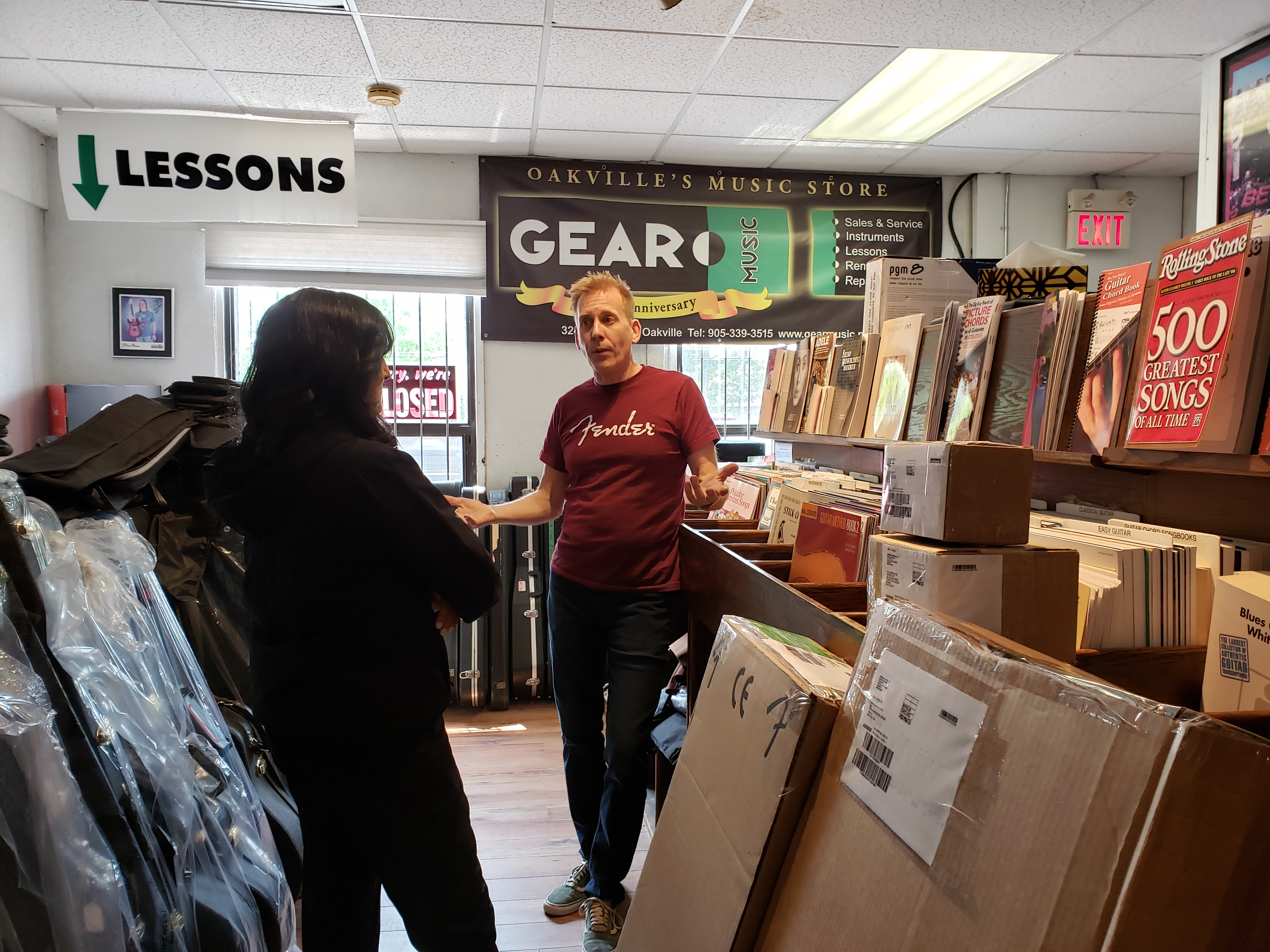 Anita Anand and Dave Goodyear chat at Gear Music on Kerr Street. | Oakville News - KA